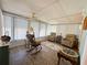Sunroom showcasing lots of natural light, comfortable seating and an open atmosphere at 121 Bougainvillea Dr, Leesburg, FL 34748