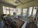 Cozy sunroom with tile flooring, comfortable seating, and ample natural light at 121 Bougainvillea Dr, Leesburg, FL 34748