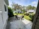 Outdoor patio area is great for seating and enjoying the landscaped yard and serene neighborhood at 139 Royal Palm Dr, Leesburg, FL 34748