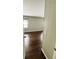 View of bedroom with wood flooring and window at 139 Royal Palm Dr, Leesburg, FL 34748