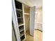 Walk-in closet featuring shelving and ample storage at 139 Royal Palm Dr, Leesburg, FL 34748