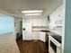 Clean and bright kitchen featuring white appliances and ample storage at 139 Royal Palm Dr, Leesburg, FL 34748