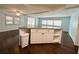 Kitchen island with granite counters, storage, and modern appliances at 139 Royal Palm Dr, Leesburg, FL 34748