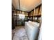 Laundry room with washer, dryer, and metal walls at 139 Royal Palm Dr, Leesburg, FL 34748