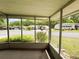 View from screened patio looking out to the community, landscaping, and other residences at 139 Royal Palm Dr, Leesburg, FL 34748