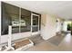 View of screened porch entrance leading to the front door of the home at 139 Royal Palm Dr, Leesburg, FL 34748
