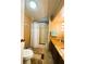 Bathroom with standing shower, tile floor, dark wood cabinet, and countertop at 141 Aspen Cir, Leesburg, FL 34748