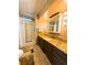 Bathroom with standing shower, tile floor, dark wood cabinet, and countertop at 141 Aspen Cir, Leesburg, FL 34748