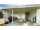 Inviting covered patio featuring a dining set and grill, perfect for outdoor entertaining and relaxation at 141 Aspen Cir, Leesburg, FL 34748