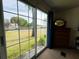 Bright room with a large sliding glass door offering outdoor views and natural light at 141 Aspen Cir, Leesburg, FL 34748
