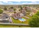 Aerial view of the home showcasing the expansive yard, swimming pool, and solar panels at 144 Pinewood Cir, Kissimmee, FL 34743