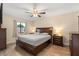 Comfortable bedroom featuring wood-look floors, neutral walls, and ample natural light at 144 Pinewood Cir, Kissimmee, FL 34743