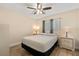 Bright bedroom with wood-look floors, neutral walls, and a ceiling fan at 144 Pinewood Cir, Kissimmee, FL 34743