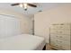Comfortable bedroom with wood-look floors, closet and a light colored dresser at 144 Pinewood Cir, Kissimmee, FL 34743
