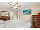 Comfortable main bedroom featuring wood floors and a spacious layout at 144 Pinewood Cir, Kissimmee, FL 34743