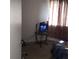 Bedroom with a small entertainment center and window with curtains at 1484 Avleigh Se Cir, Orlando, FL 32824