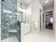 Bright bathroom features a glass-enclosed shower, modern vanity, and access to the bedroom, creating a spa-like retreat at 15373 Evans Ranch Rd, Lakeland, FL 33809
