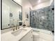 Stylish bathroom with tiled shower, quartz counters, and modern fixtures at 15373 Evans Ranch Rd, Lakeland, FL 33809