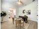 Office space showing neutral paint, stylish chairs, an area rug, and views into the formal dining room at 15373 Evans Ranch Rd, Lakeland, FL 33809