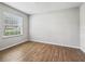 Inviting bedroom with wood floors and a bright window at 1936 Bell Creek Loop, Fruitland Park, FL 34731