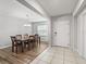 Bright dining room features tile and wood flooring, ample natural light at 1936 Bell Creek Loop, Fruitland Park, FL 34731