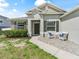 Inviting front entrance with brick pavers, seating, and decorative accents at 1936 Bell Creek Loop, Fruitland Park, FL 34731