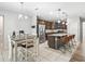 Well-equipped kitchen with stainless steel appliances and a granite island with seating at 1936 Bell Creek Loop, Fruitland Park, FL 34731