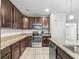 Stylish kitchen with granite countertops, stainless appliances, and ample cabinet space at 1936 Bell Creek Loop, Fruitland Park, FL 34731