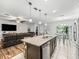 Spacious living area with a seamless flow between kitchen, dining, and relaxation spaces at 1936 Bell Creek Loop, Fruitland Park, FL 34731