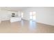 Open-concept living room featuring tile floors, abundant light, and modern kitchen at 2173 Lincoln Ln, Bartow, FL 33830