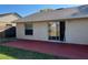 Backyard features a stained concrete patio, grass, and a building exterior at 2408 Fabry Cir, Orlando, FL 32817