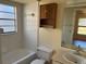 Bathroom features tile, a window, a vanity, a mirror, and a toilet at 2408 Fabry Cir, Orlando, FL 32817