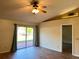Inviting living room features hardwood floors, sliding glass doors and a ceiling fan for a comfortable living space at 2408 Fabry Cir, Orlando, FL 32817