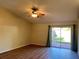 Inviting living room features hardwood floors, sliding glass doors and a ceiling fan for a comfortable living space at 2408 Fabry Cir, Orlando, FL 32817