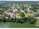 Aerial view of the home and extra lot with water views, circled in red for clarity at 2561 Rogers Rd, Lakeland, FL 33812