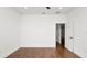 This bedroom features wood floors and neutral paint at 2561 Rogers Rd, Lakeland, FL 33812