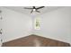Bright bedroom featuring hardwood floors, neutral walls, a ceiling fan, and natural light from window at 2561 Rogers Rd, Lakeland, FL 33812