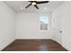 This bedroom features dark wood floors, recessed lighting, and a window at 2561 Rogers Rd, Lakeland, FL 33812