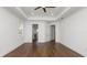 Spacious bedroom with beautiful hardwood floors, neutral walls, and modern ceiling fan at 2561 Rogers Rd, Lakeland, FL 33812
