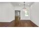 Dining room features hardwood floors, classic trim and a decorative chandelier at 2561 Rogers Rd, Lakeland, FL 33812