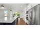 Close up of island with granite countertop, stainless steel appliances and view to covered patio at 2561 Rogers Rd, Lakeland, FL 33812