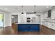 Beautiful kitchen with blue island, granite counters, stainless appliances, and pendant lighting at 2561 Rogers Rd, Lakeland, FL 33812