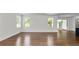Open living room showcasing hardwood floors, recessed lighting, and access to a covered patio at 2561 Rogers Rd, Lakeland, FL 33812