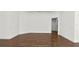 Spacious living room showcasing hardwood floors, classic trim and neutral tones at 2561 Rogers Rd, Lakeland, FL 33812