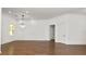 Bright and airy living room with hardwood floors, modern lighting and neutral paint at 2561 Rogers Rd, Lakeland, FL 33812