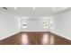 Large, open living room showcasing hardwood flooring and recessed lighting throughout the space at 2561 Rogers Rd, Lakeland, FL 33812