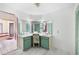 A vanity table with hollywood lighting in a unique bathroom with a tub in a side room at 34 Misty Meadow Ln, Mulberry, FL 33860