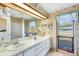 Large bathroom with double vanity, shower and tub at 34 Misty Meadow Ln, Mulberry, FL 33860