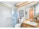 Bathroom featuring shower, toilet and wooden vanity at 34 Misty Meadow Ln, Mulberry, FL 33860