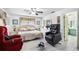 Bright bedroom featuring tile flooring, a ceiling fan and comfortable furniture at 34 Misty Meadow Ln, Mulberry, FL 33860